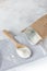 Crumbly xanthan gum in a wooden spoon