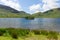 Crummock Water island and mountains Lake District North West England UK