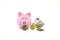 Crumpled banknotes, coins and piggy bank