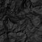 Crumpled black paper background. grunge texture. Torn black paper