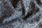 Crumpled blue grey melange woolen fabric