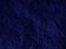 Crumpled dark blue paper texture background