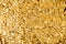 Crumpled golden foil shining texture background, bright shiny gold luxury design, metallic glitter surface