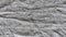 Crumpled gray fabrics with horizontal lines
