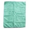 Crumpled green microfiber cloth on white background