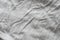 Crumpled grey textile texture. Fabric Texture Background