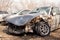 A crumpled hood and a broken windshield of a car that got into an accident