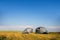 Crumpled metal grain storage bins damaged by wind