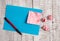 Crumpled note paper and blank cardboard above wooden table. Wrinkle sheet plus stationary stick to classic background in