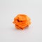 Crumpled orange paper ball isolated