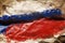 Crumpled paper background with a Russian flag. Copy space. Concept of world crisis and war