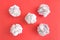 Crumpled paper balls on red background