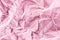 Crumpled pink paper for background