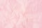 Crumpled pink paper background