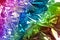 Crumpled rainbow wrapping paper with shiny effect. Close up