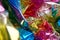 Crumpled rainbow wrapping paper with shiny effect. Close up