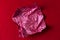 Crumpled red candy wrapper