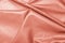 Crumpled rose gold leather as background, closeup