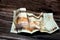 Crumpled Saudi Arabia money of 10 SAR ten riyals isolated on wooden background, wrinkled 10 Saudi Riyals cash bill banknote