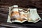 Crumpled Saudi Arabia money of 10 SAR ten riyals isolated on wooden background, wrinkled 10 Saudi Riyals cash bill banknote