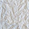 Crumpled white paper textured pattern