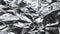 Crumpled wrinkled textured gray surface of aluminum foil close-up.