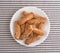 Crunchy baked twisted cookies on a plate