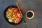 Crunchy chicken katsu and soy sauce served with wooden chopsticks