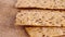 Crunchy crispbreads with sesame and flax seeds. Healthy dietary meal. Macro.