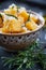 Crunchy croutons in bowl with rosemary