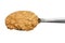 Crunchy peanut butter on metal spoon