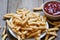 Crunchy prawn crackers or shrimp crisp traditional snack - prawn crackers stick on plate and ketchup