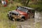 Crush Orange Jeep Rubicon crossing muddy pond