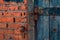 crush red brick wall texture and dark classic blue wood texture grunge background, old interior design, panorama of masonry