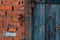 crush red brick wall texture and dark classic blue wood texture grunge background, old interior design, panorama of masonry patter