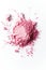 Crushed Pink Blush Makeup Powder Scatter on a White Background