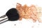 Crushed powder bronzer blush and powder brush on white background