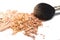 Crushed powder bronzer blush and powder brush on white background