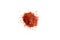 Crushed red pepper chilli pile from top on white background