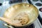 Crushed taro in brass pan prepare for making thai dessert