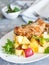 Crusted cod with peach and pineapple salsa