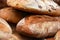 Crusty Fresh Artisan Bread Loaves with black olives and walnuts