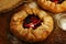 Crusty open pies or galette with apples and summer berries