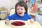 Crying child dont want to eat red soup