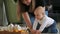 Crying cute baby boy sitting on the floor at home and then crawling to her mom