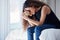 Crying, depression and woman with teddy bear on bed for grief, miscarriage or mourning death of kid. Sad mother, tears