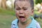 Crying little boy. Cry. Portrait of boy. Caucasian child looks at camera. Charming boy the kid cries with tears in his eyes. an