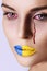 Crying Ukrainian woman with a bloody tears