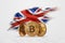 Crypto currency, gold coin BITCOIN BTC. Coin bitcoin against the background of the flag of Great Britain. The concept a new
