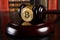 Crypto currency law, judge gavel, stacked legal book and bitcoin